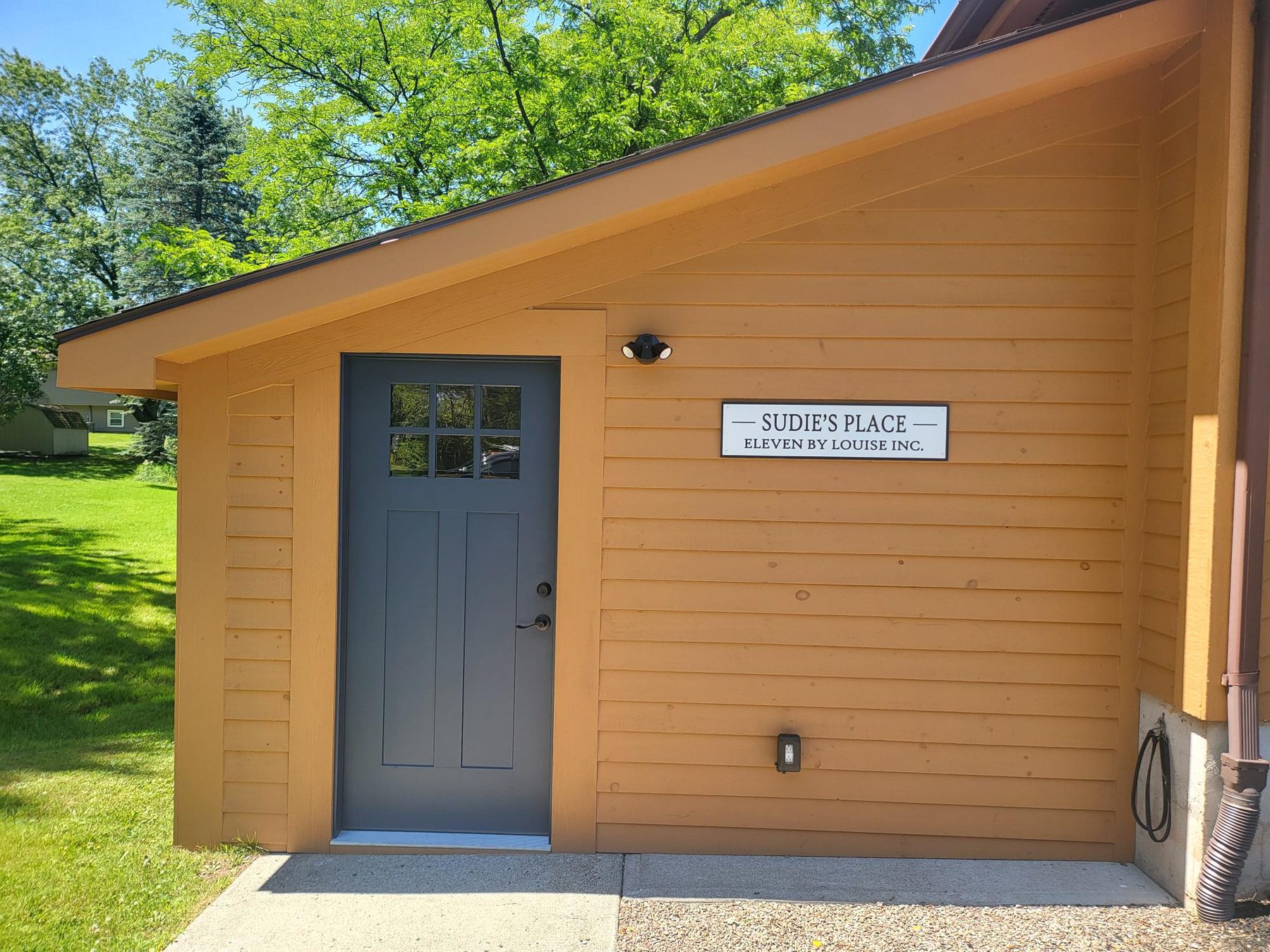 The lower level entrance at Sudie's Place, 6204 Slocum Road